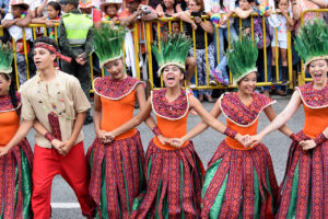 traditional dancers in The Desfile de Silleteros (Parade of Flowers) during the Feria de las Flores is an annual festival in Colombia, South America